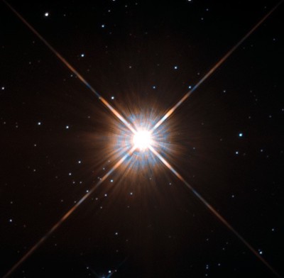 Shining brightly in this **Hubble** image is our closest stellar neighbour: **Proxima Centauri**. These observations were taken using Hubble’s **Wide Field and Planetary Camera 2** (**WFPC2**).