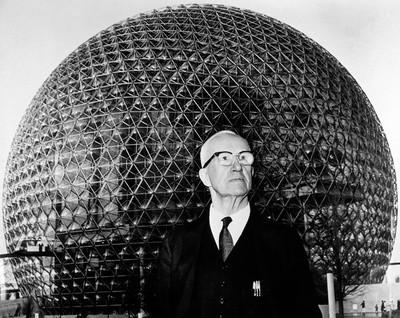 **Buckminster Fuller** himself, in front of the geodesic dome of the [**Montreal Biosphere**](https://en.wikipedia.org/wiki/Montreal\_Biosphere) that he designed.