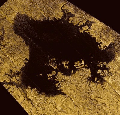 **Ligeia Mare**, shown here in a false-color **Cassini** image, is the **second largest** known body of liquid on Saturn's moon, **Titan**. It is filled with liquid hydrocarbons, such as **ethane** and **methane**, and is one of the many seas and lakes that bejewel Titan's north polar region. Dark areas (**low-radar return**) are colored **black**, while bright regions (**high-radar return**) are colored **yellow** to white. Image Credit: **NASA**/**JPL-Caltech**/**ASI**/**Cornell**.